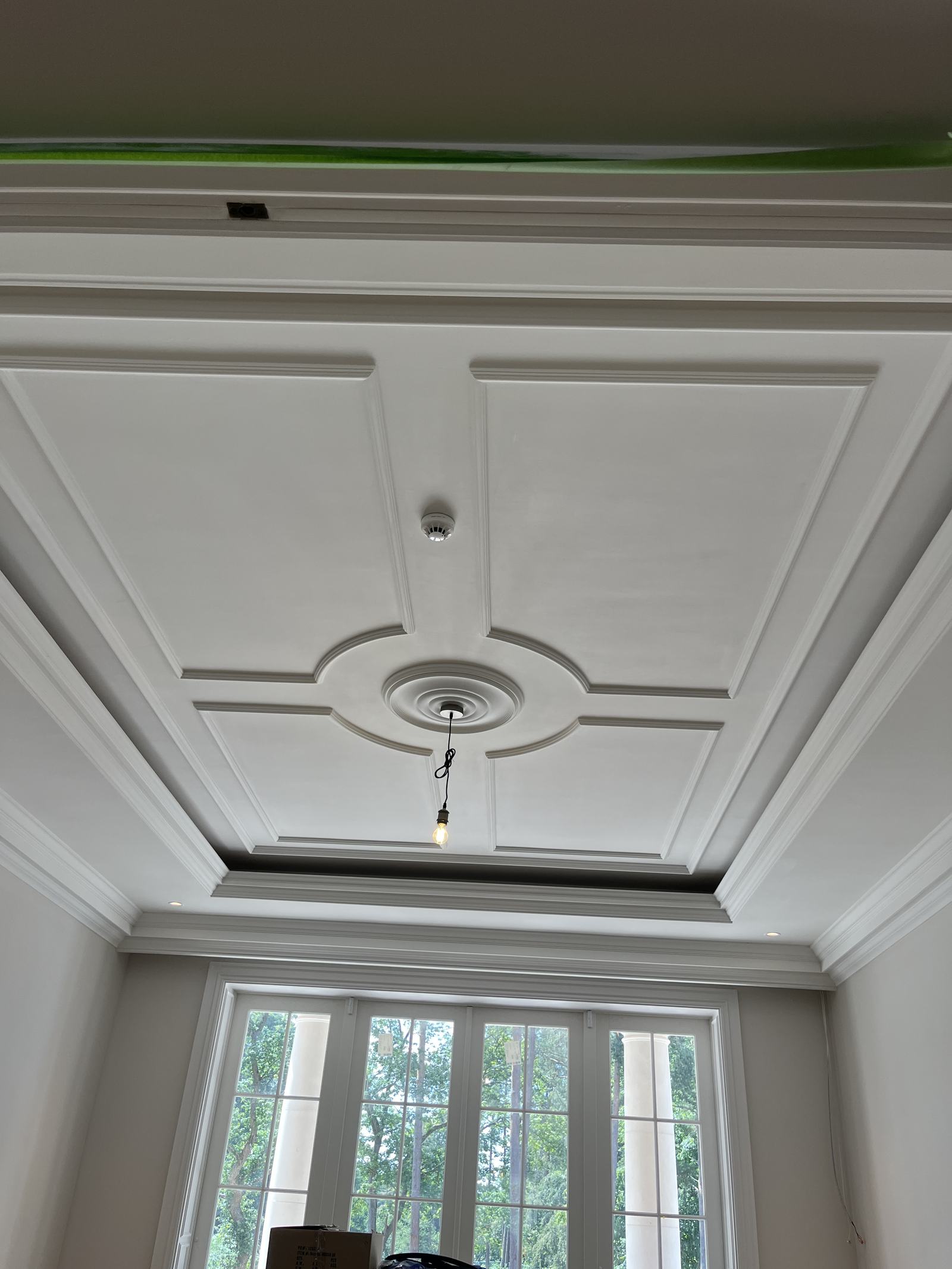 Slot ventilation integrated into an ornate coffered ceiling