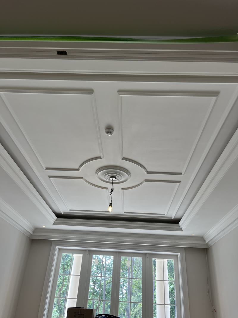Slot ventilation integrated into an ornate coffered ceiling